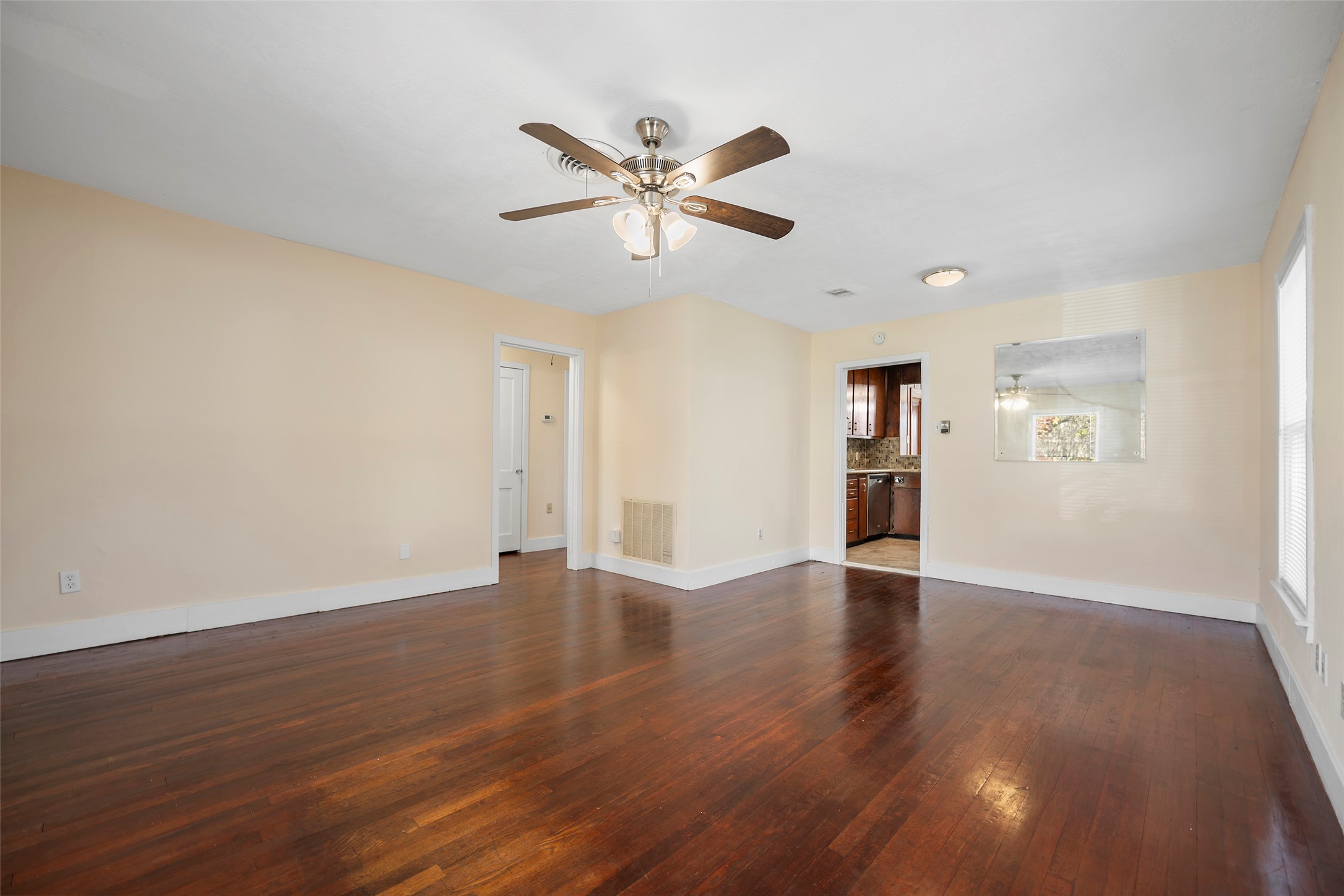 4111 Law Street West University Place, TX 77005 - Photo 10 of 29 a view of an empty room with window and wooden floor
