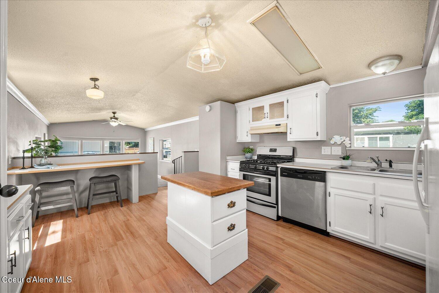 9090 North Runkle Road Hayden, ID 83835 - Photo 14 of 40 Kitchen island great for extra . . .