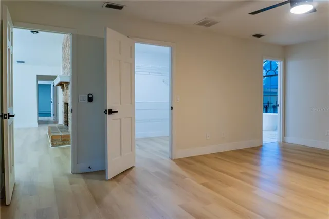 a view of kitchen with refrigerator and window