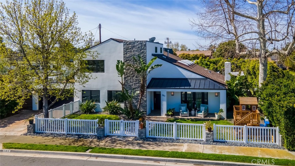 283 Lilac Lane Costa Mesa, CA 92627 - Photo 1 of 22 a view of house with a big yard and large trees