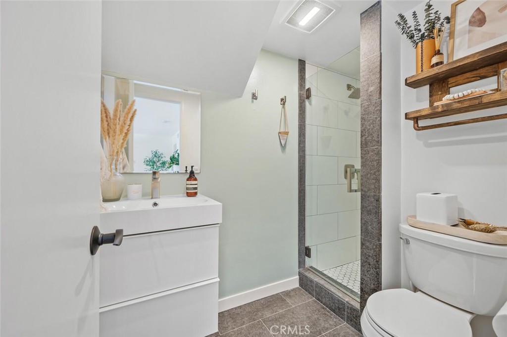 283 Lilac Lane Costa Mesa, CA 92627 - Photo 13 of 22 a bathroom with a sink toilet and shower
