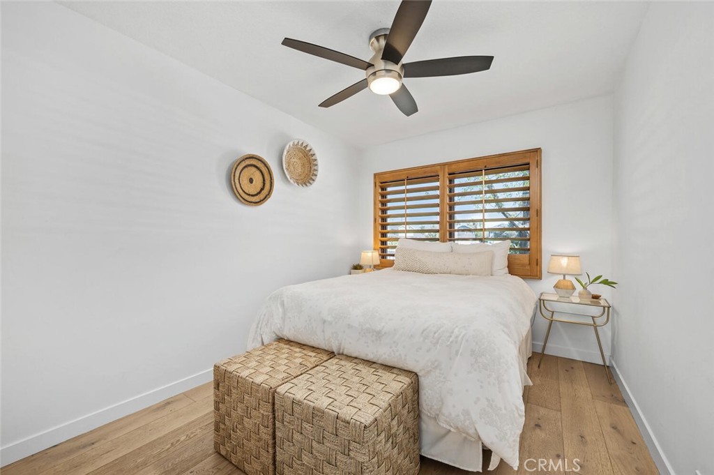 283 Lilac Lane Costa Mesa, CA 92627 - Photo 10 of 22 a bedroom with a bed and a window