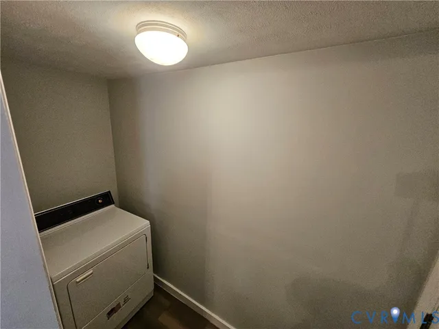 a room with a dryer and washer