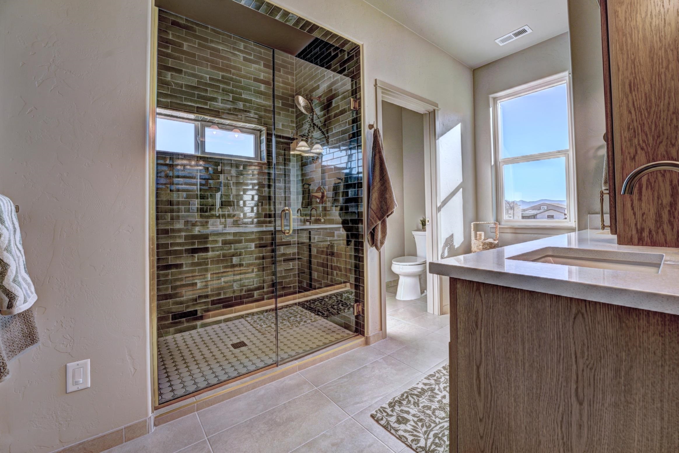 1985 Tomochic Drive Fruita, CO 81521 - Photo 39 of 41 a bathroom with a shower sink and mirror
