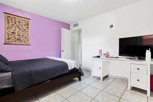 a utility room with cabinets washer and dryer
