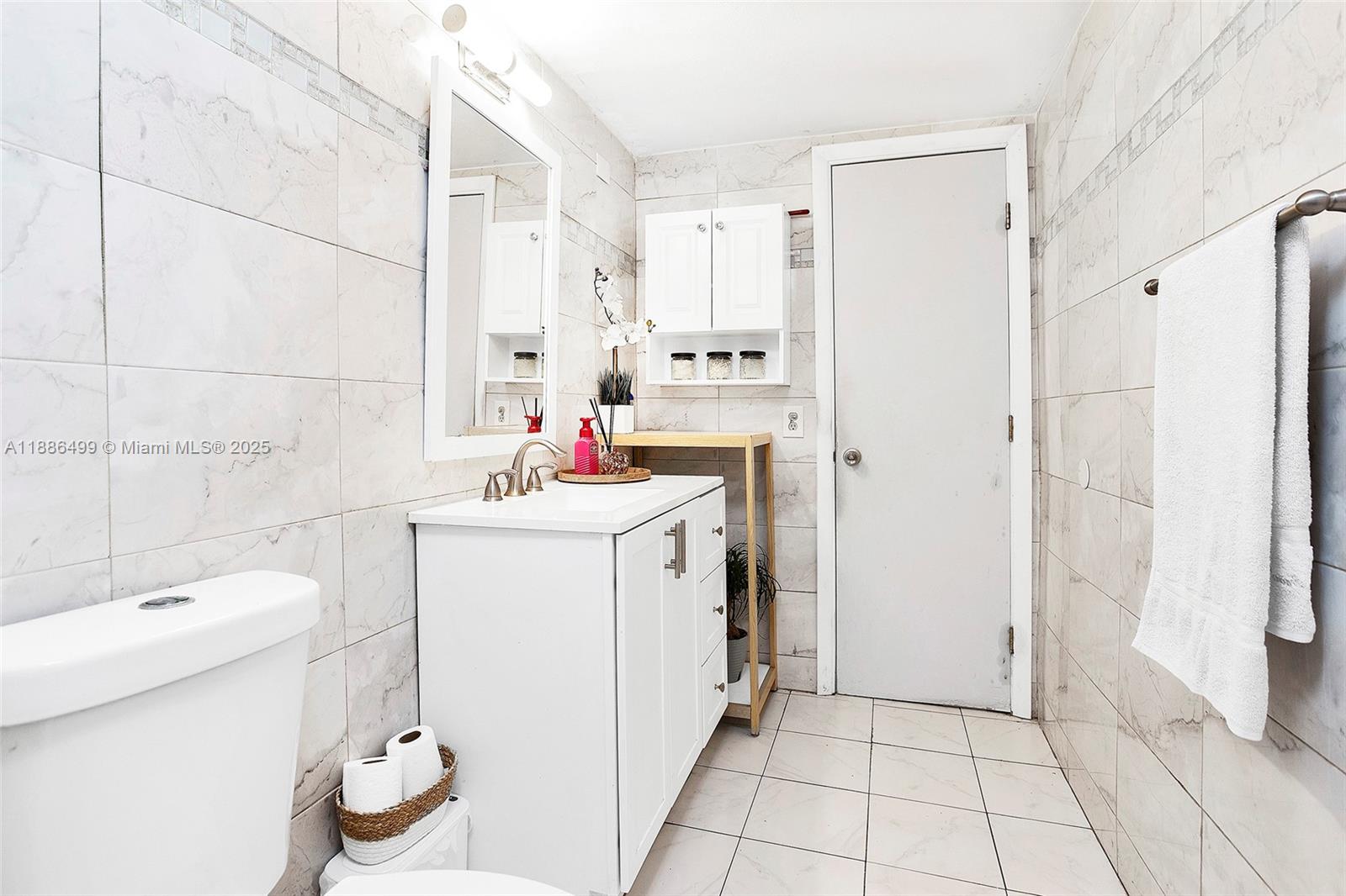 1850 West 56th Street, Unit 2207 Hialeah, FL 33012 - Photo 21 of 33 a utility room with cabinets washer and dryer