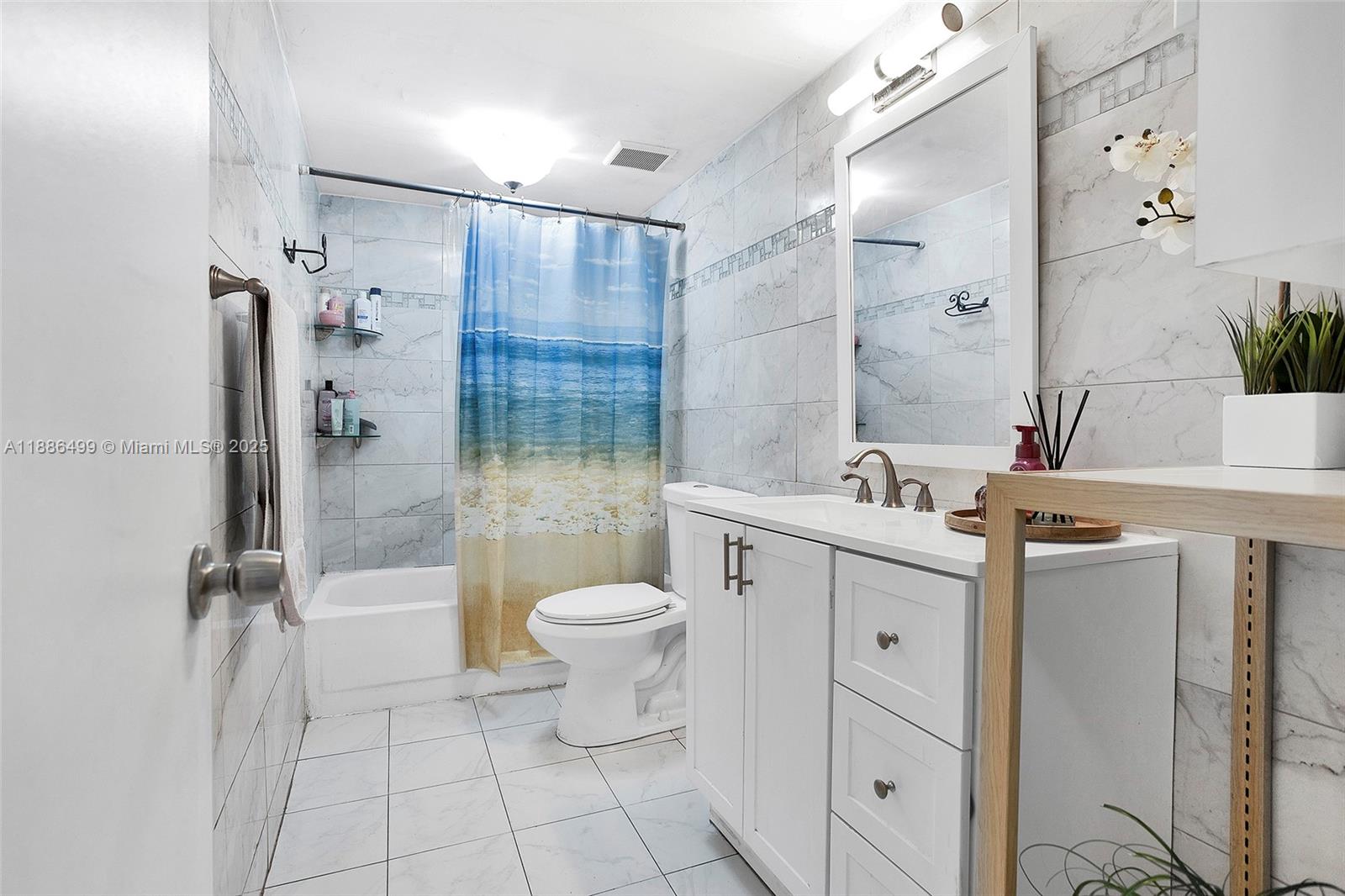 1850 West 56th Street, Unit 2207 Hialeah, FL 33012 - Photo 22 of 33 a bathroom with a sink toilet and shower
