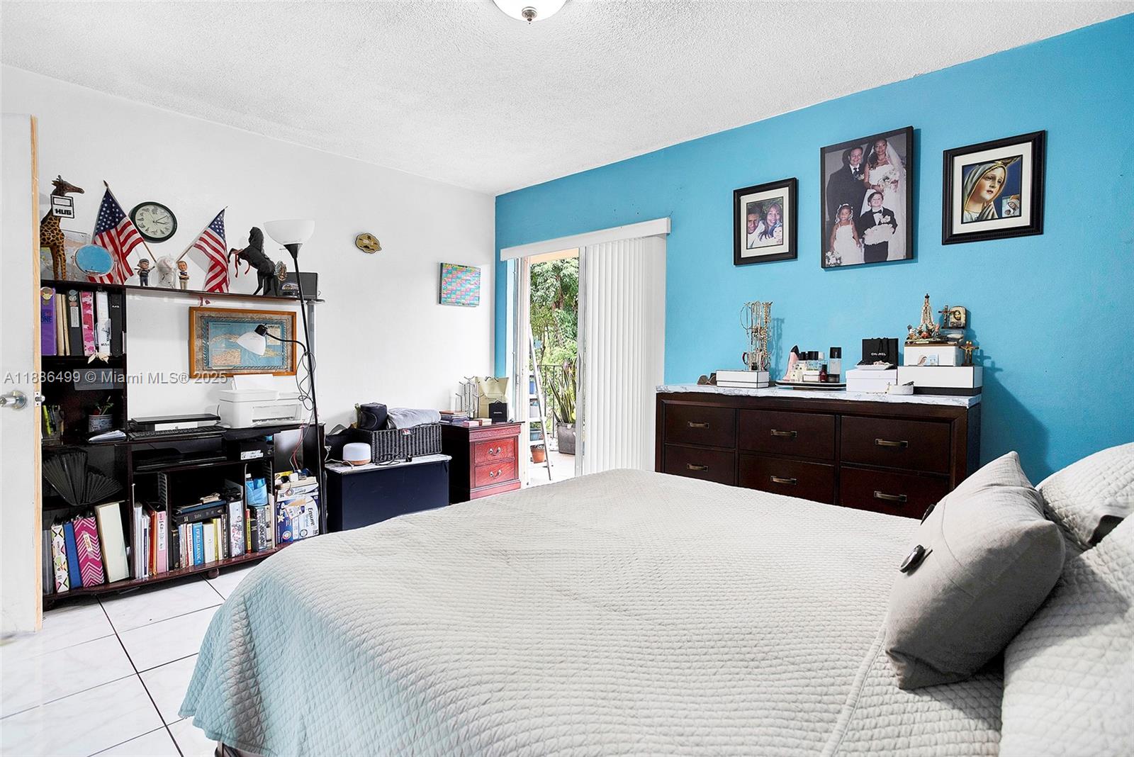 1850 West 56th Street, Unit 2207 Hialeah, FL 33012 - Photo 26 of 33 a bed room with a bed and a television