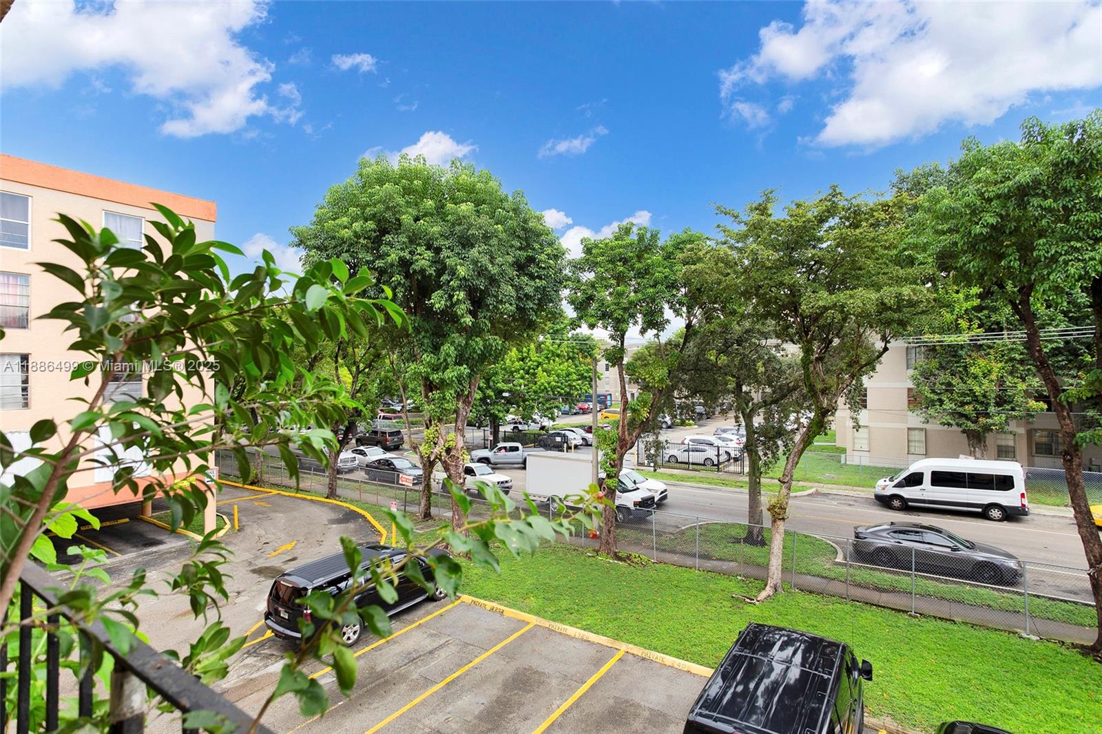 1850 West 56th Street, Unit 2207 Hialeah, FL 33012 - Photo 29 of 33 a view of a park with plants and a bench