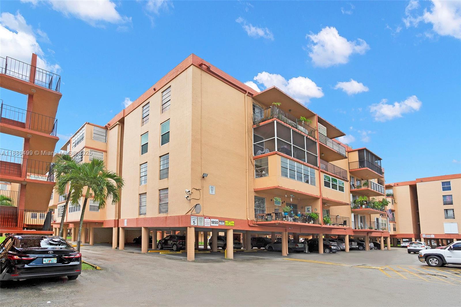 1850 West 56th Street, Unit 2207 Hialeah, FL 33012 - Photo 8 of 33 a view of a street with cars