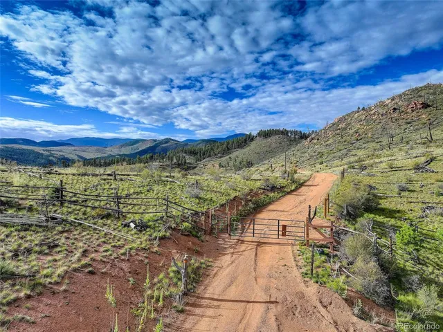 a view of a town with mountains in the background