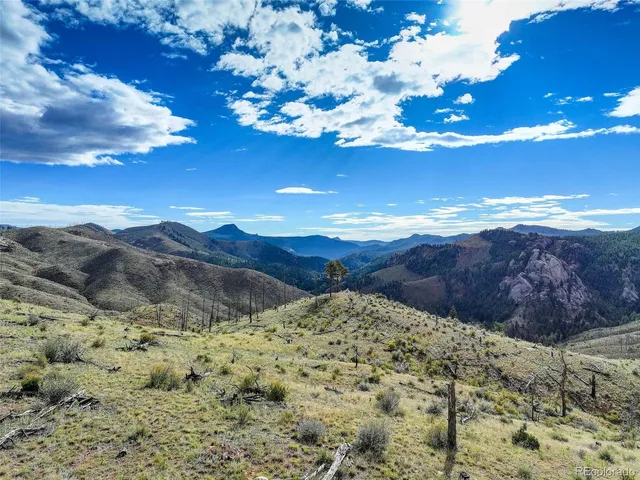 a view of mountains and valleys