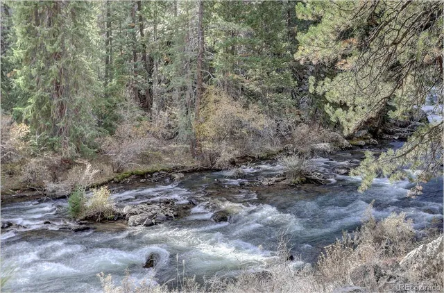 a view of a lake with mountain