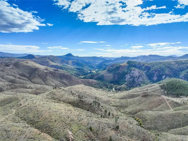 a view of a sky with mountains in the background