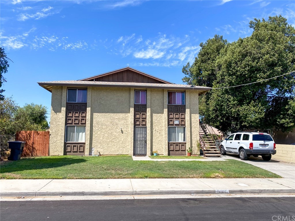 3872 Taft Street Riverside, CA 92503 - Photo 1 of 1 a front view of a house with a garden