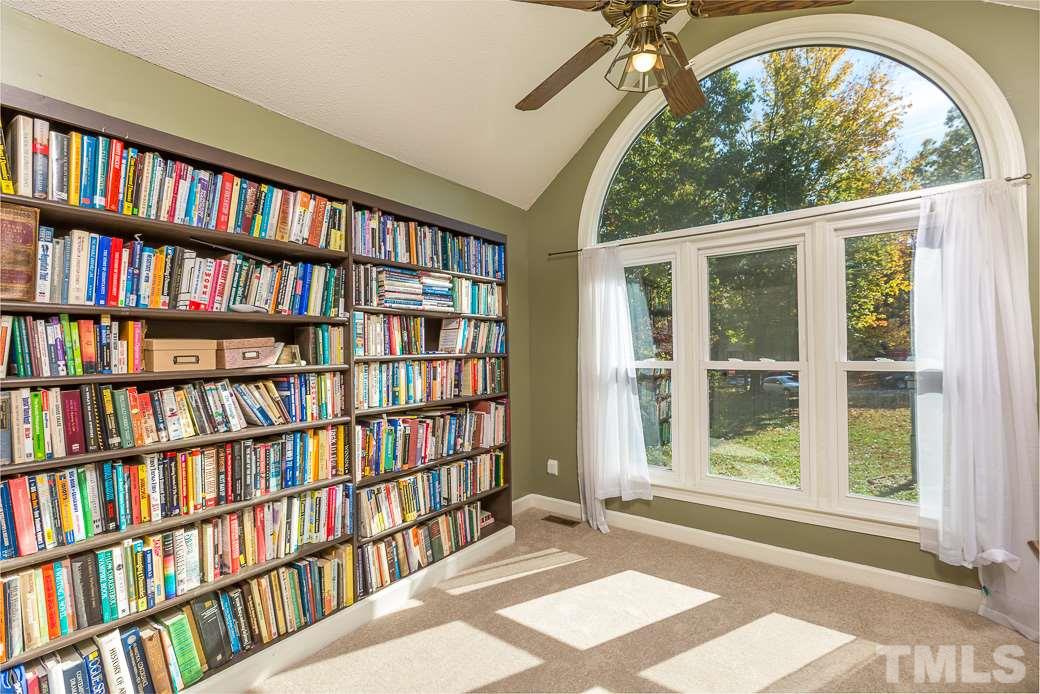 4004 Sherlock Court Raleigh, NC 27613 - Photo 2 of 11 Guest bedroom boasts TONS OF NATURAL LIGHT, VAULTED CEILINGS, and NEW CARPET! Let your guests relax with this picturesque view!
