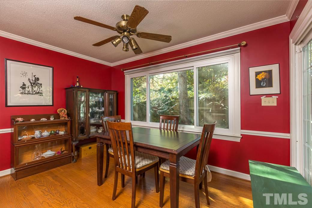 4004 Sherlock Court Raleigh, NC 27613 - Photo 5 of 11 Dining room has TRIPLE PANDED WINDOWS and access to the SPACIOUS DECK and the kitchen that makes this home perfect for entertaining! This room is finished off with HARDWOOD FLOORS and TONS OF NATURAL LIGHT