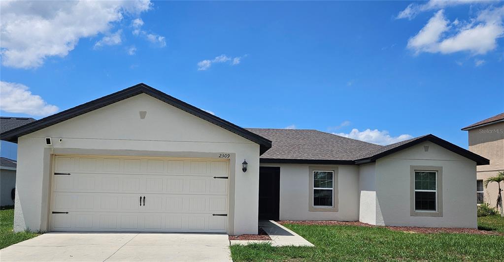 2309 Rio Grande Forest Lane Kissimmee, FL 34759 - Photo 1 of 12 a view of a house with a yard