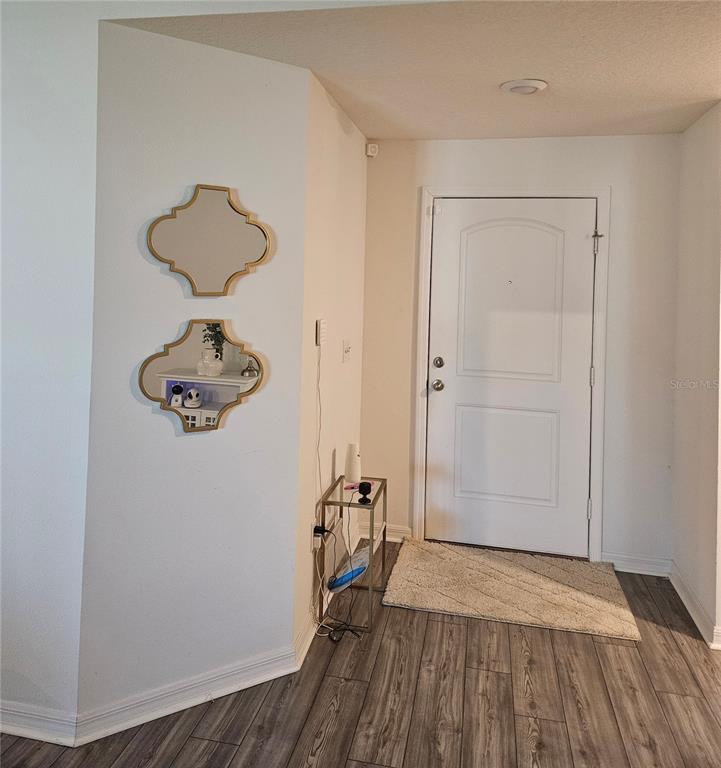 2309 Rio Grande Forest Lane Kissimmee, FL 34759 - Photo 12 of 12 a view of a room with wooden floor and a carpet