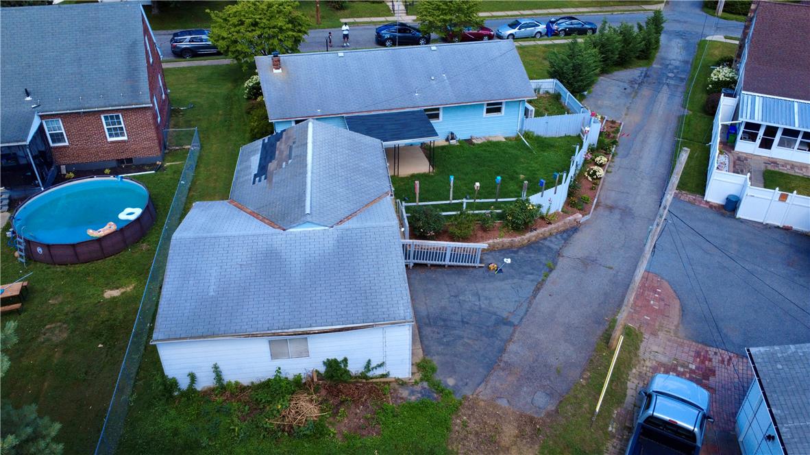 719 Keystone Avenue Bethlehem, PA 18018 - Photo 5 of 32 An aerial perspective reveals a cozy home with a fenced yard and a refreshing above-ground pool.