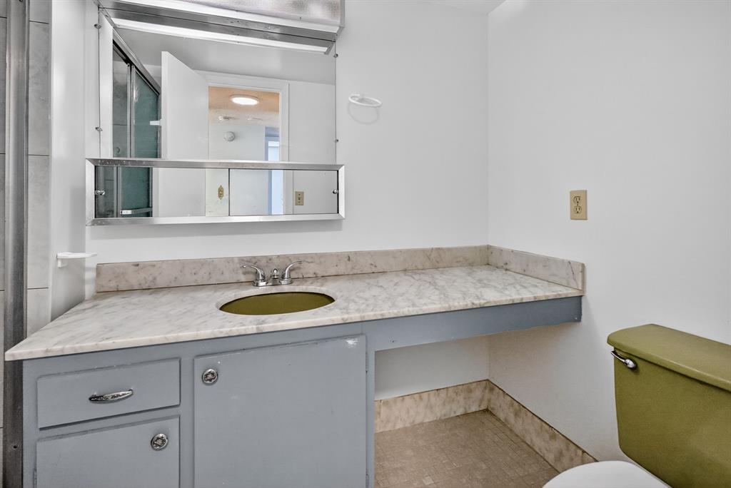 2750 Northeast 183rd Street, Unit 911 Aventura, FL 33160 - Photo 11 of 34 a bathroom with a granite countertop sink and a mirror