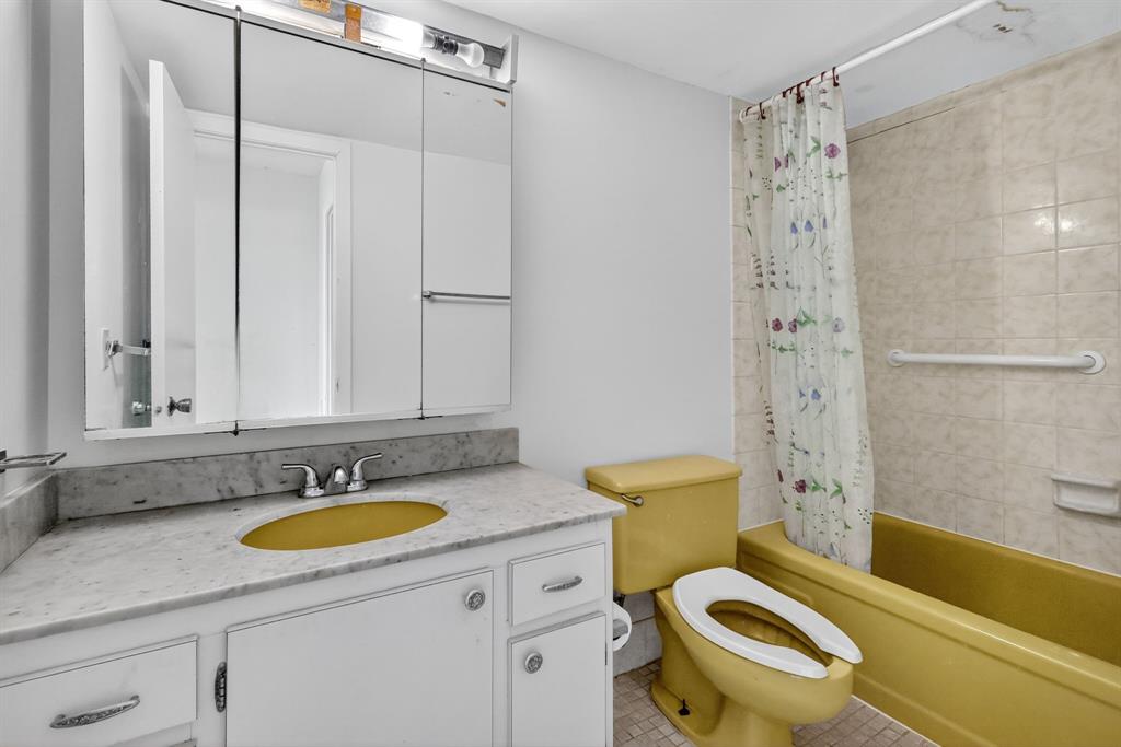 2750 Northeast 183rd Street, Unit 911 Aventura, FL 33160 - Photo 17 of 34 a bathroom with a granite countertop toilet sink and shower