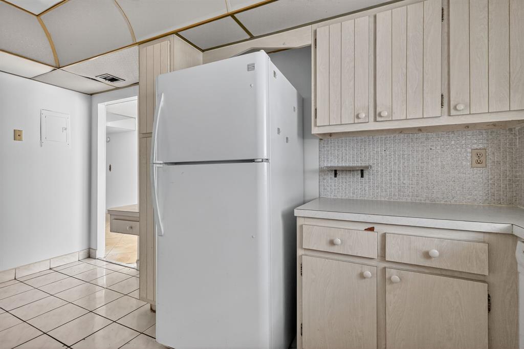 2750 Northeast 183rd Street, Unit 911 Aventura, FL 33160 - Photo 28 of 34 a white refrigerator freezer sitting inside of a kitchen