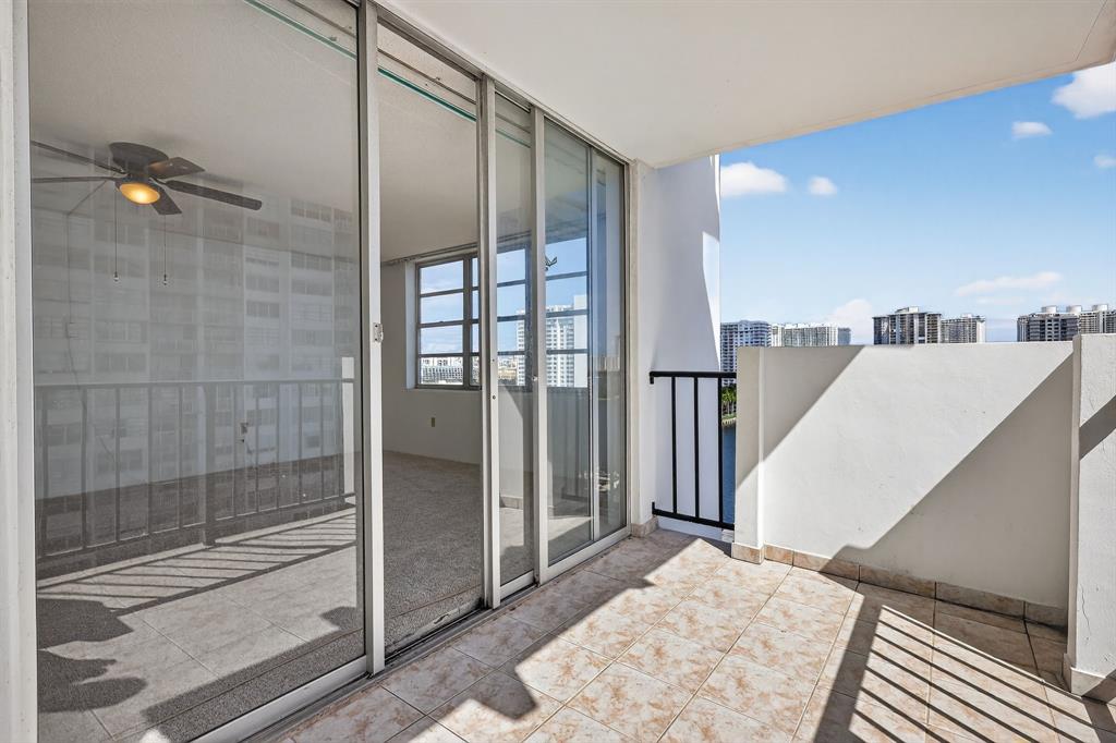 2750 Northeast 183rd Street, Unit 911 Aventura, FL 33160 - Photo 31 of 34 a view of a bathroom with a glass door shower