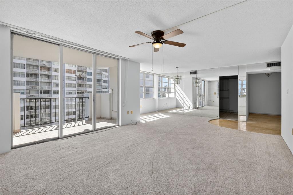 2750 Northeast 183rd Street, Unit 911 Aventura, FL 33160 - Photo 6 of 34 a view of livingroom with hardwood floor and ceiling fan