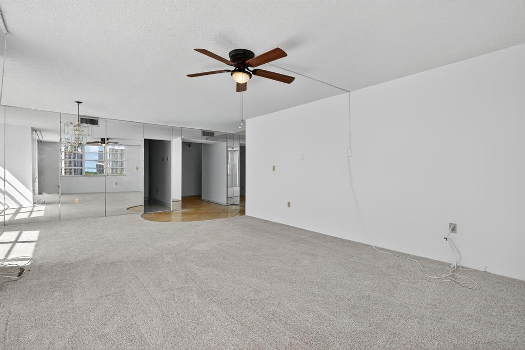 2750 Northeast 183rd Street, Unit 911 Aventura, FL 33160 - Photo 7 of 34 a view of a livingroom with a ceiling fan and window