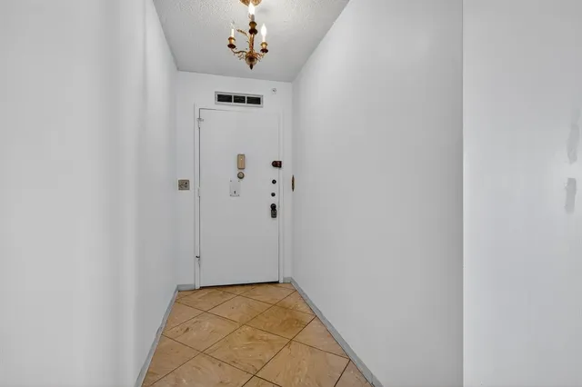 a view of an entryway with a chandelier