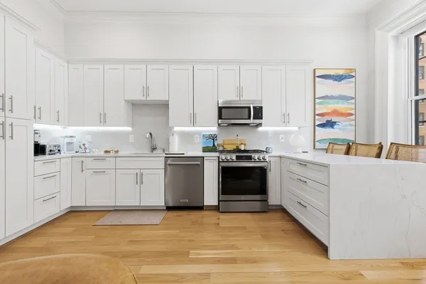 a bedroom with a bed and a chair