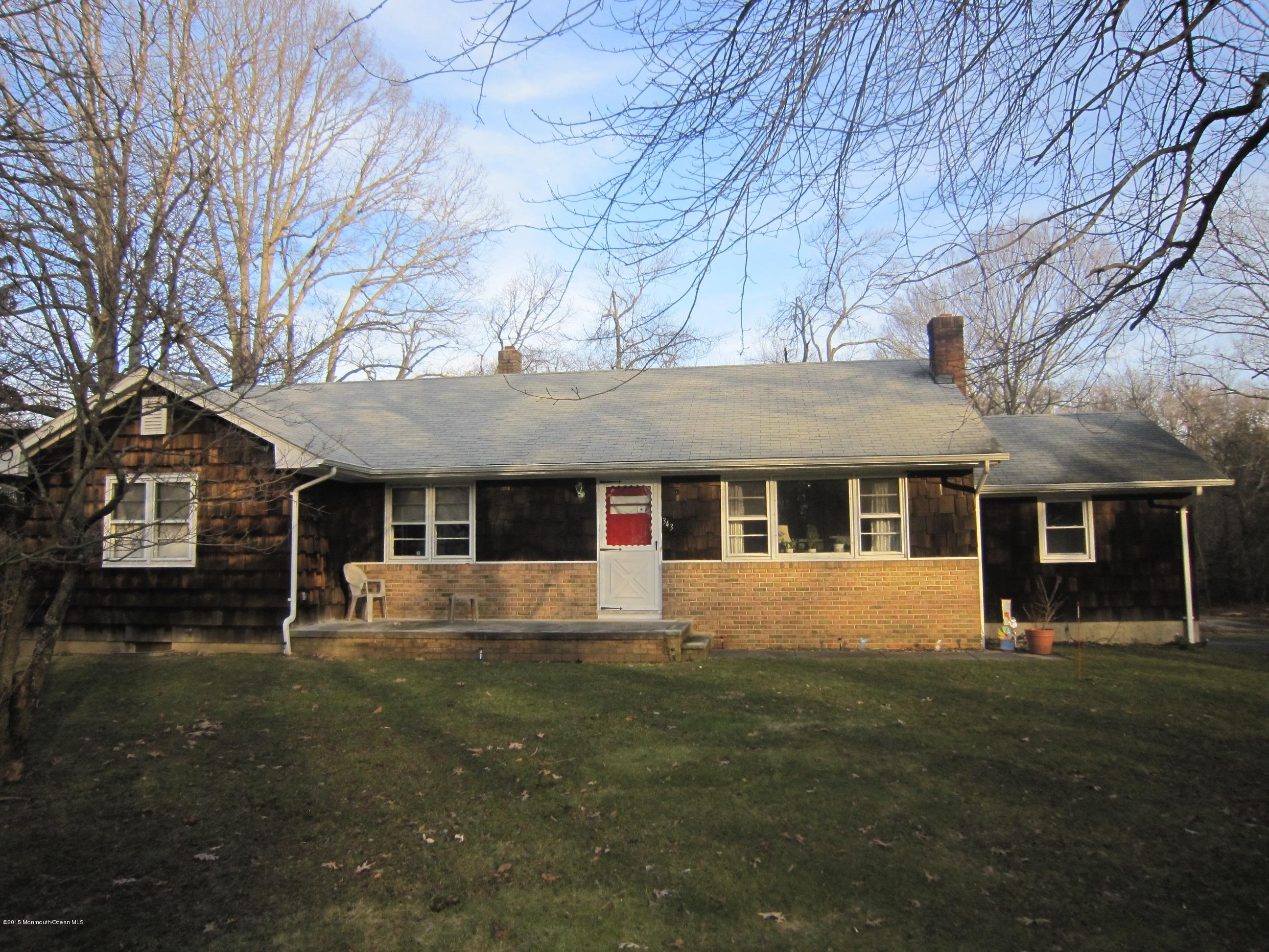 343 Colts Neck Road Farmingdale, NJ 07727 - Photo 1 of 3 a front view of a house with a yard