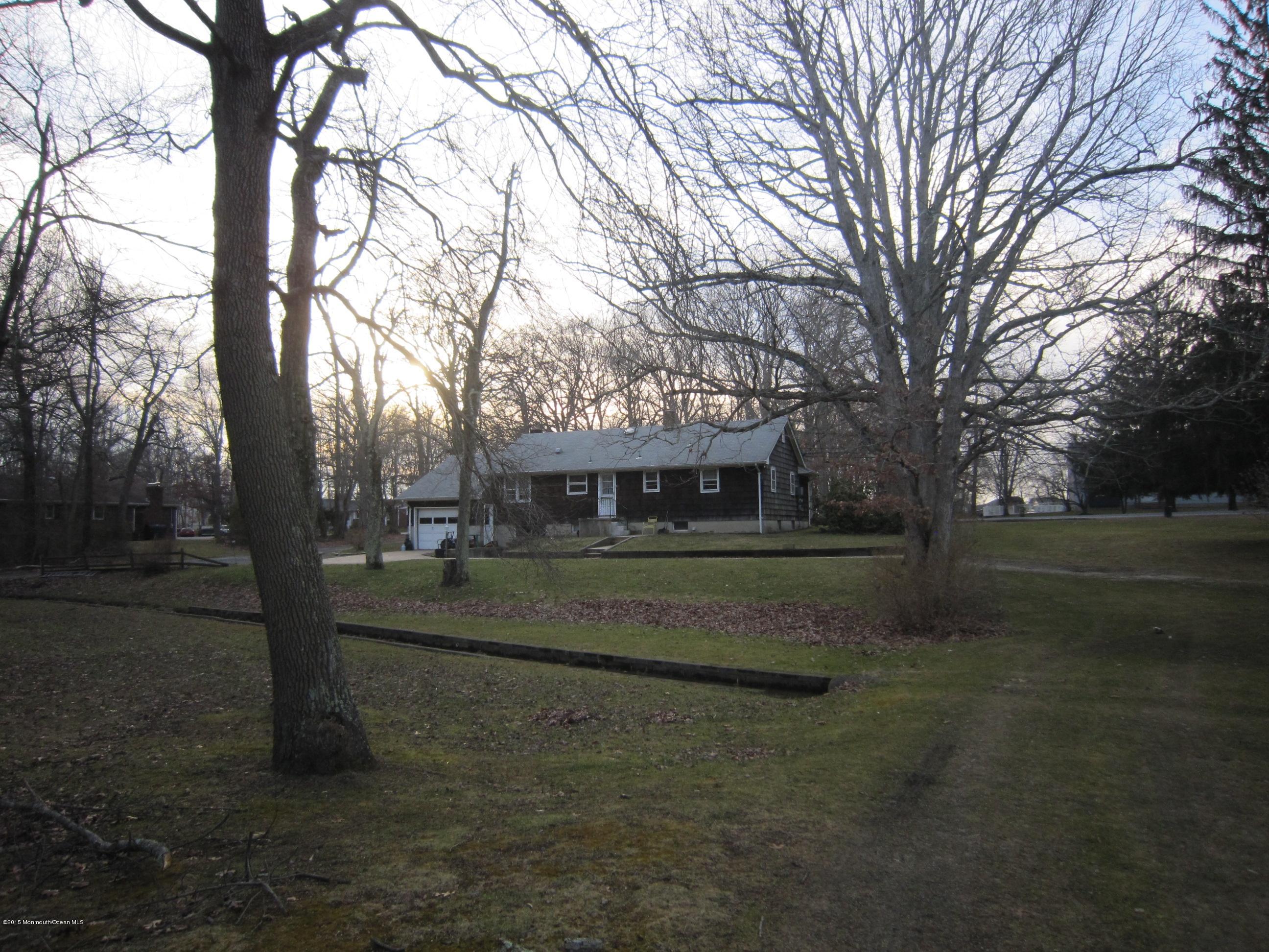 343 Colts Neck Road Farmingdale, NJ 07727 - Photo 3 of 3 a view of a house with a yard