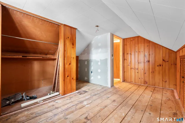 a view of an empty room with glass door