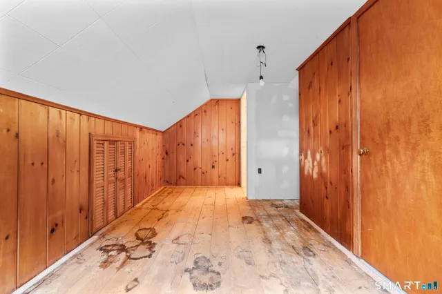 a view of a room with a wooden walls