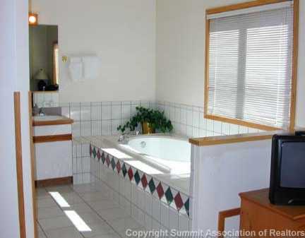 56 View Lane, Unit 7F Breckenridge, CO 80424 - Photo 13 of 16 a bathroom with a bathtub and a sink