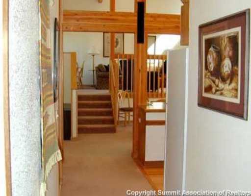 56 View Lane, Unit 7F Breckenridge, CO 80424 - Photo 6 of 16 a view of a hallway with wooden floor and windows