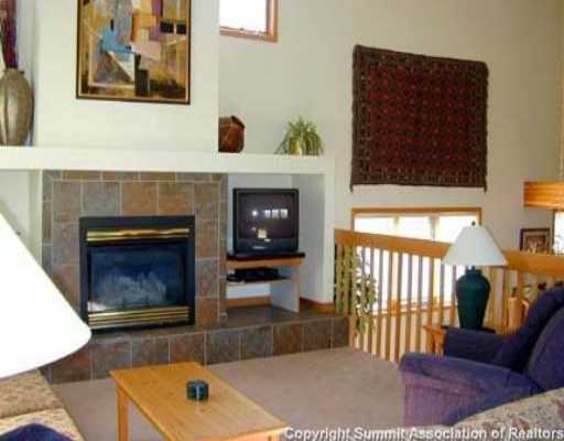 56 View Lane, Unit 7F Breckenridge, CO 80424 - Photo 9 of 16 a living room with furniture and a fireplace