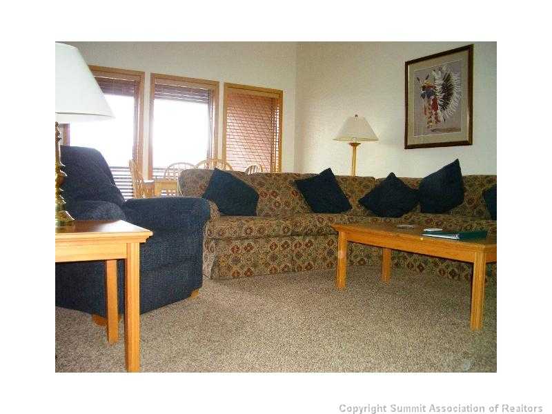 56 View Lane, Unit 7F Breckenridge, CO 80424 - Photo 10 of 16 a living room with furniture and a window