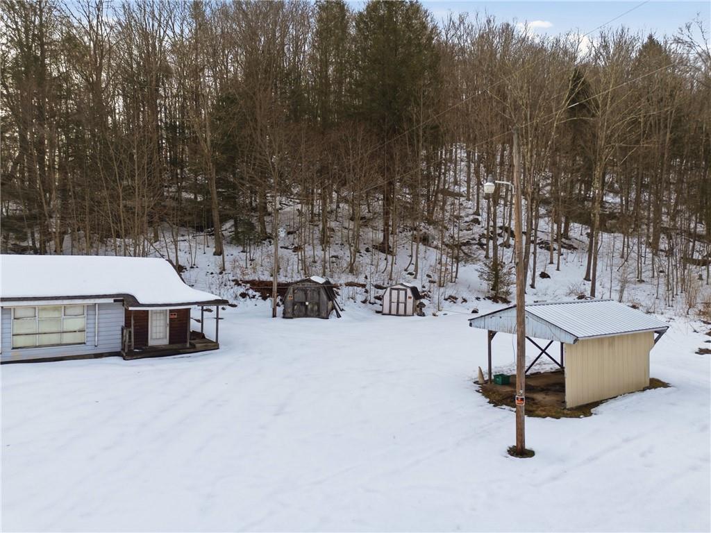 169 Glenview Road Somerset, PA 15501 - Photo 5 of 17 a swimming pool with outdoor seating and trees