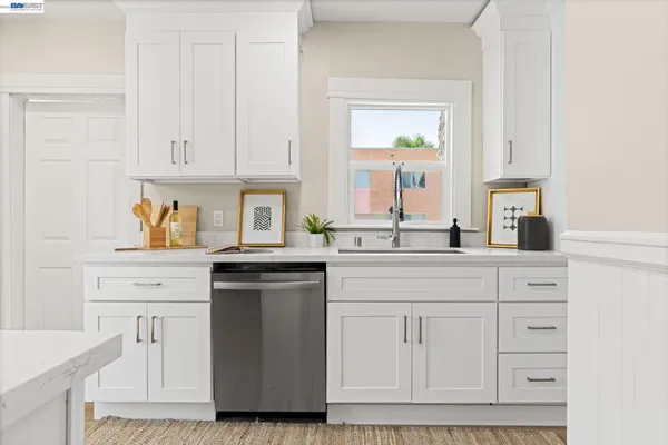 a kitchen with stainless steel appliances granite countertop a sink and stove top oven