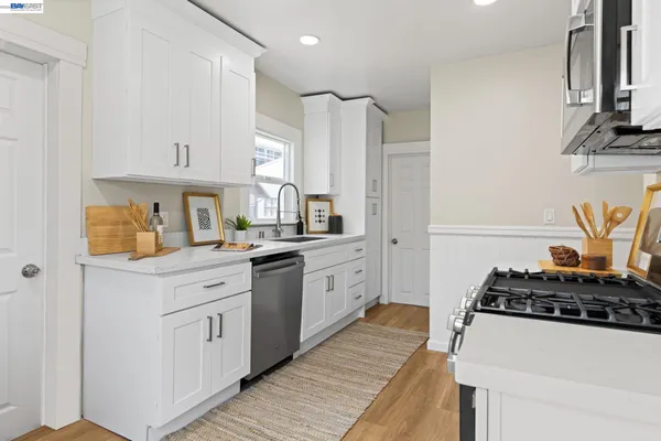 a kitchen with a stove and a microwave