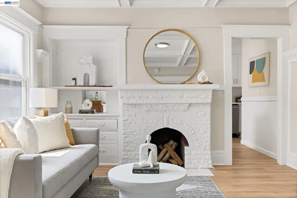 a kitchen with white cabinets and appliances