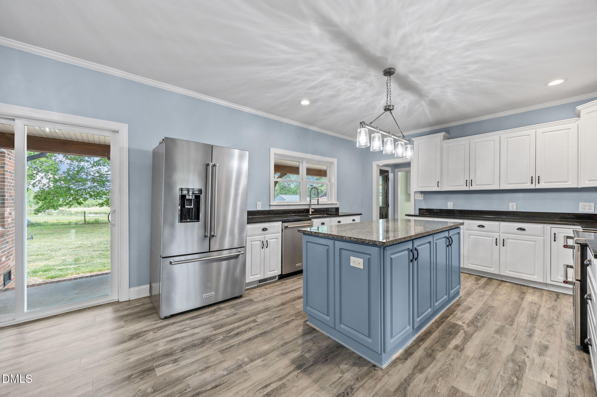 3611 Chewning Road Oxford, NC 27565 - Photo 5 of 45 a kitchen with granite countertop a refrigerator and a sink
