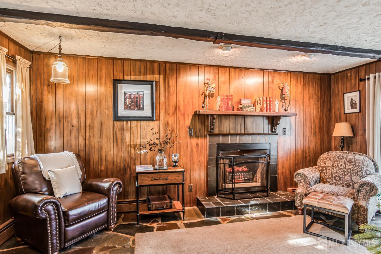 25 Simpson Avenue Edison, NJ 08817 - Photo 12 of 25 a living room with furniture and a fireplace
