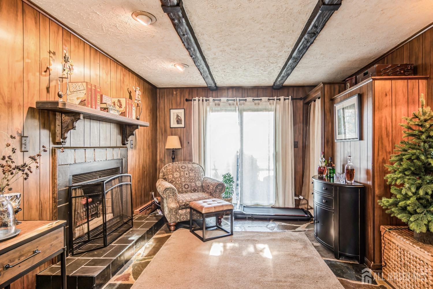 25 Simpson Avenue Edison, NJ 08817 - Photo 15 of 25 a living room with furniture a fireplace and large windows
