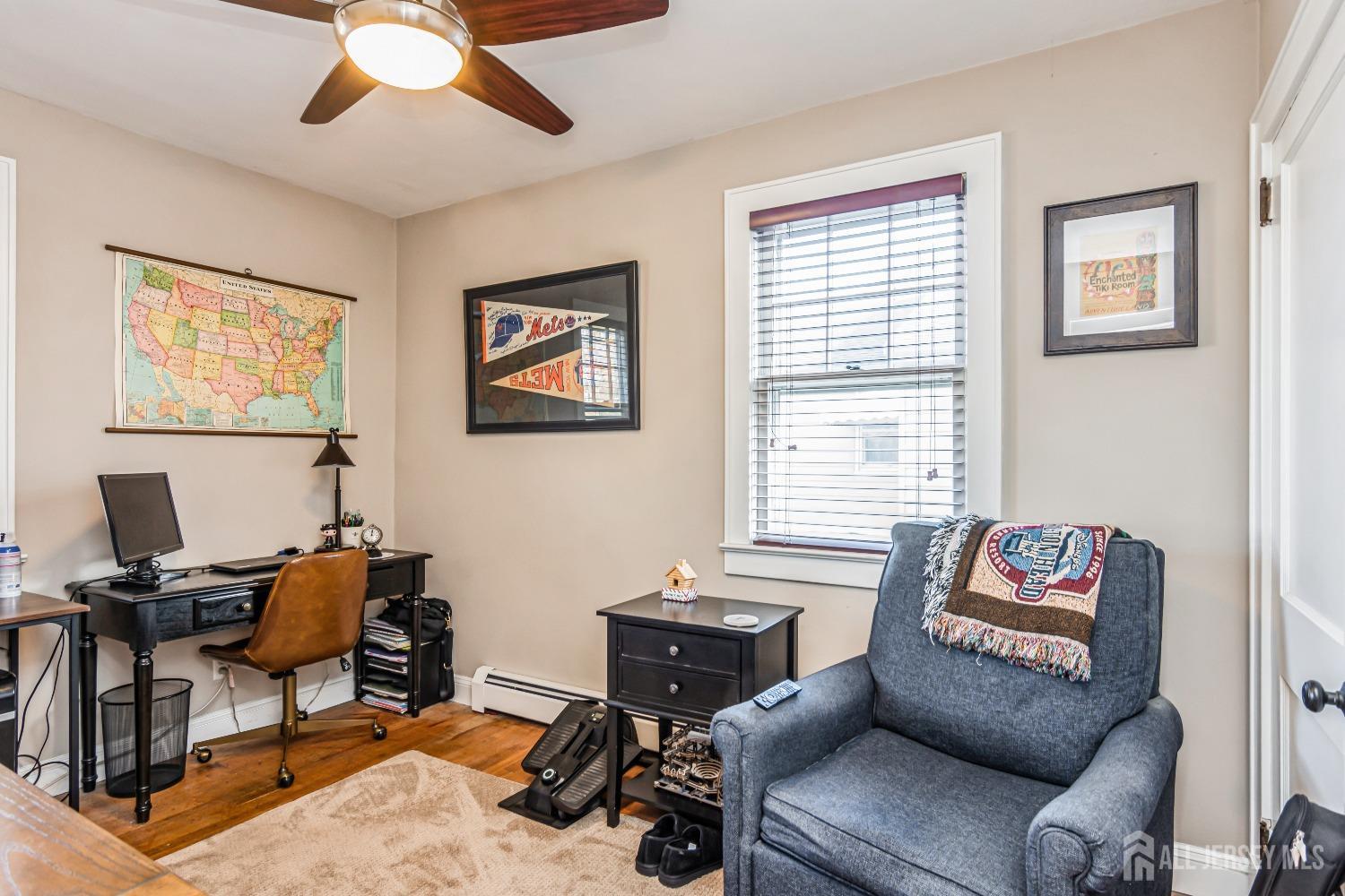25 Simpson Avenue Edison, NJ 08817 - Photo 16 of 25 a living room with furniture and a window