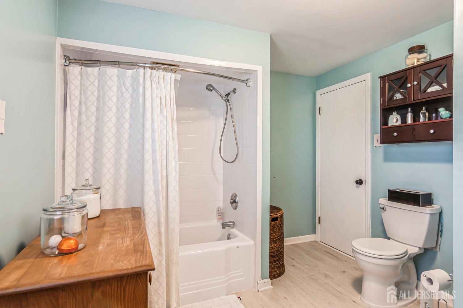 25 Simpson Avenue Edison, NJ 08817 - Photo 22 of 25 a bathroom with a granite countertop bathtub shower sink vanity and toilet