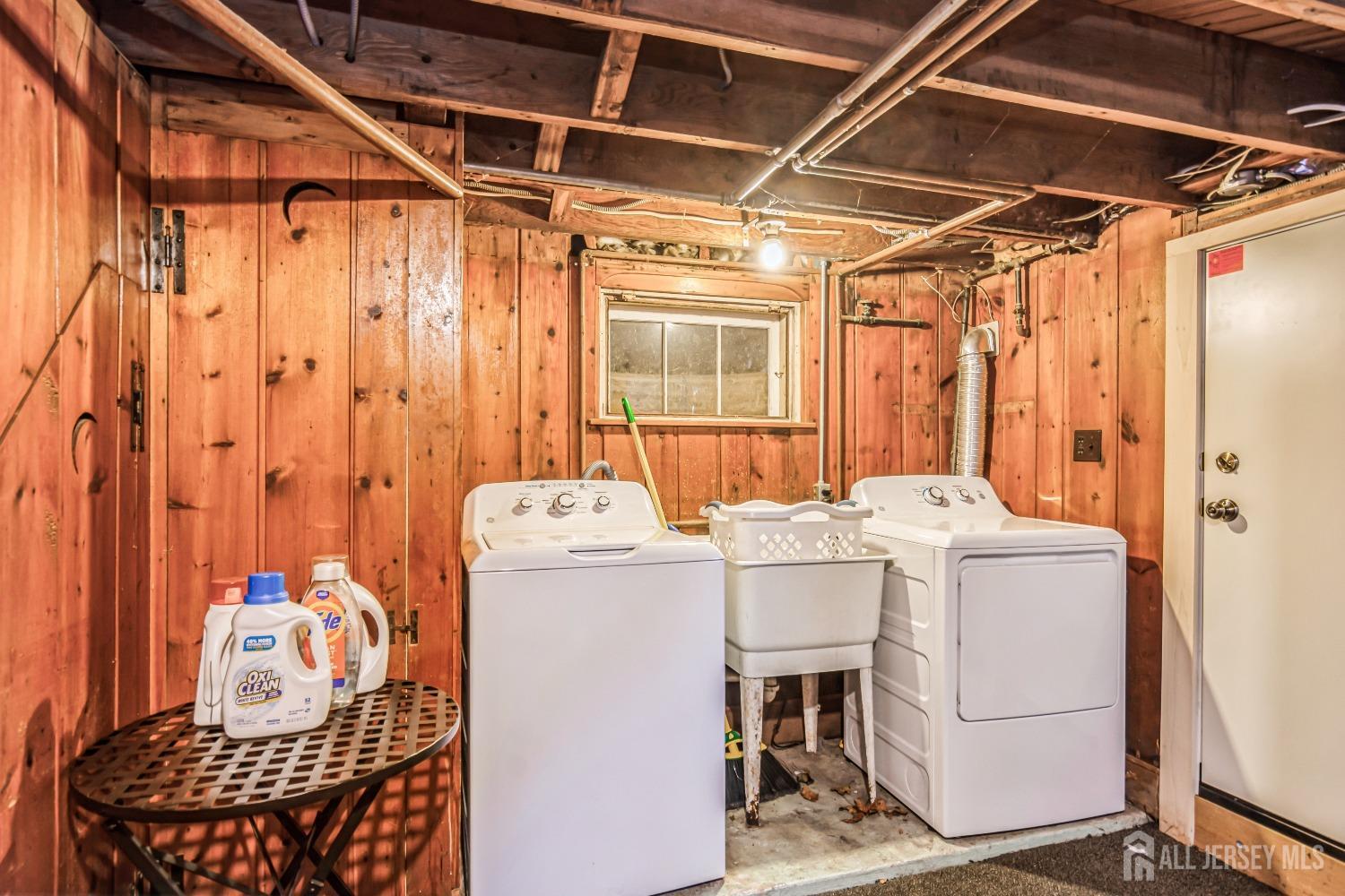 25 Simpson Avenue Edison, NJ 08817 - Photo 23 of 25 a utility room with dryer and washer